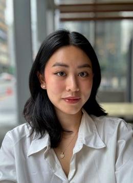 portrait of claire hong wearing a white collared blouse